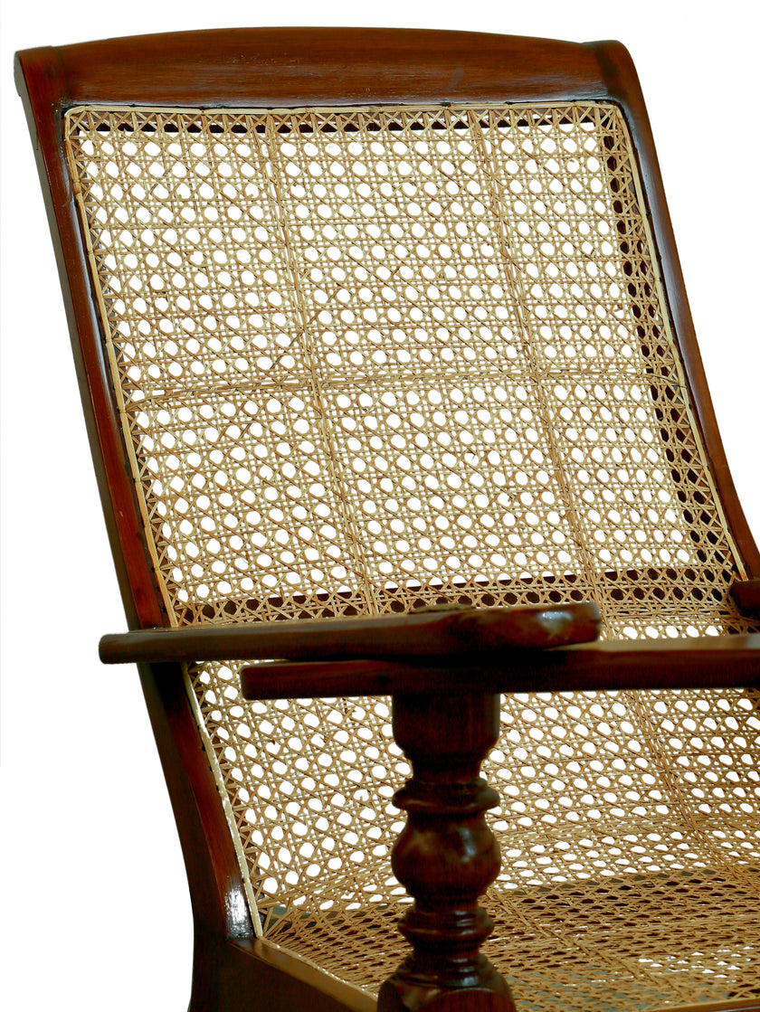 Detail of the hand-woven cane seat and teak frame on the Kerala plantation chair